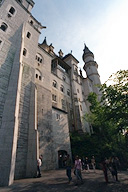 Tourists mill around the castle gates
